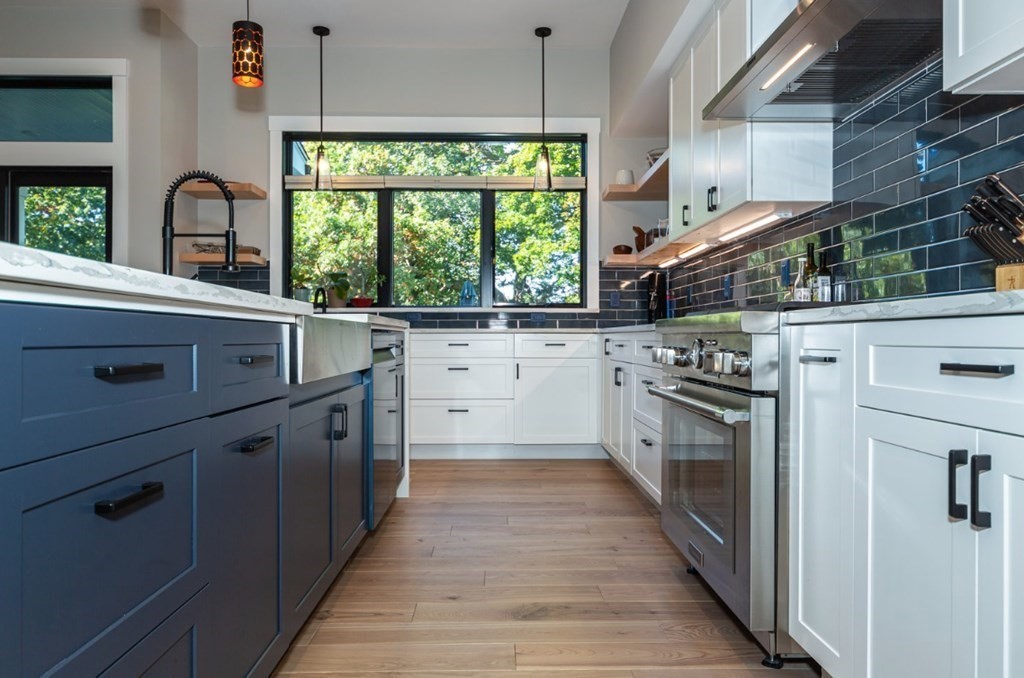 29 Beverly Road Natick, MA 01760 - Photo 8 of 16 a kitchen with stainless steel appliances a stove sink and cabinets