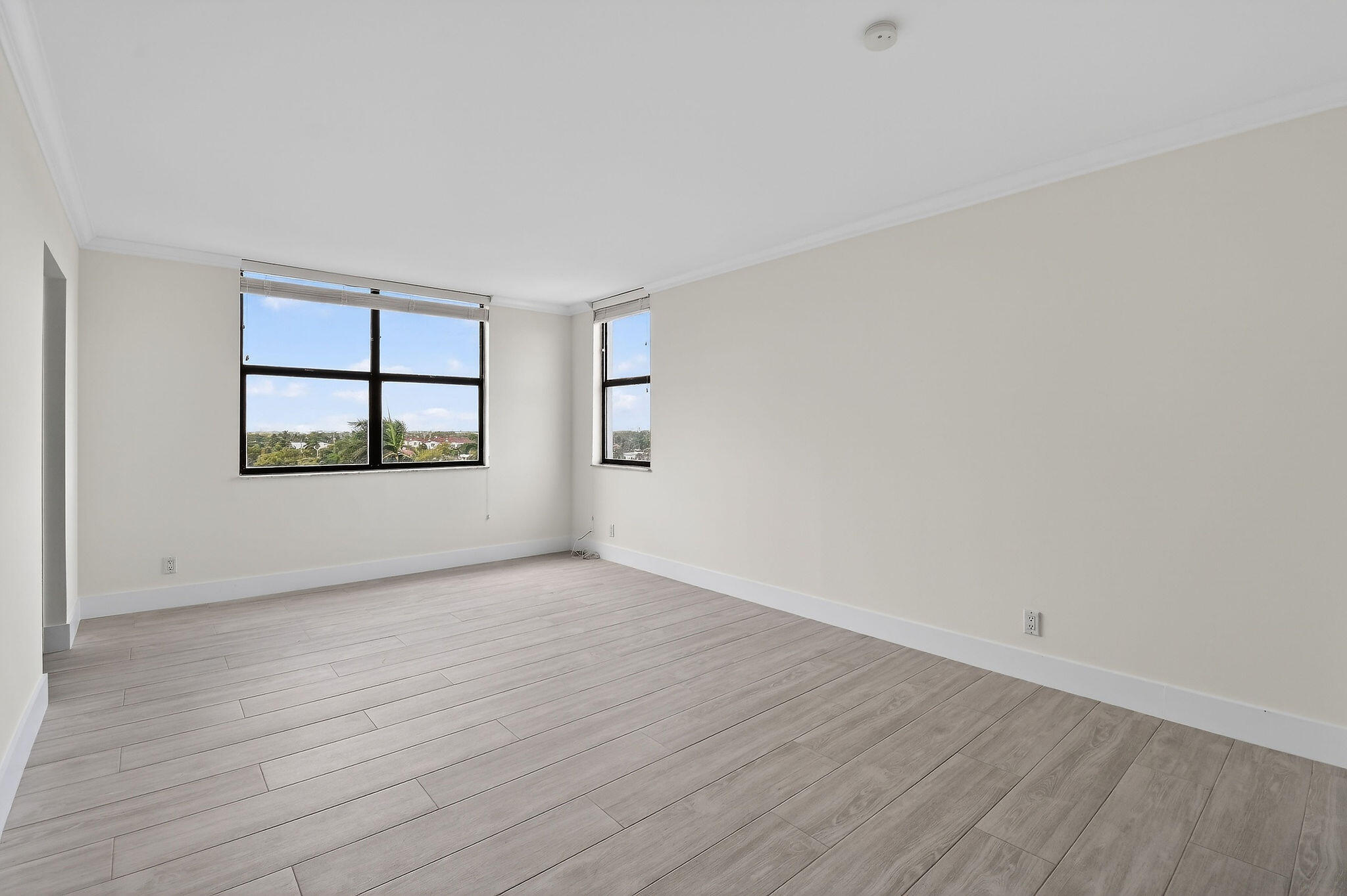 3800 Washington Road, Unit 712 West Palm Beach, FL 33405 - Photo 15 of 48 wooden floor in an empty room with a window