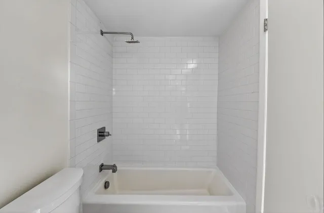 a close up of a bathtub curtain