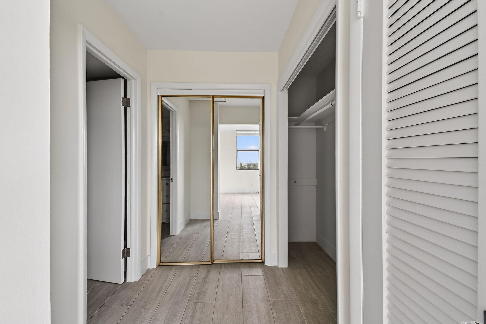 3800 Washington Road, Unit 712 West Palm Beach, FL 33405 - Photo 26 of 48 a view of a hallway with wooden floor
