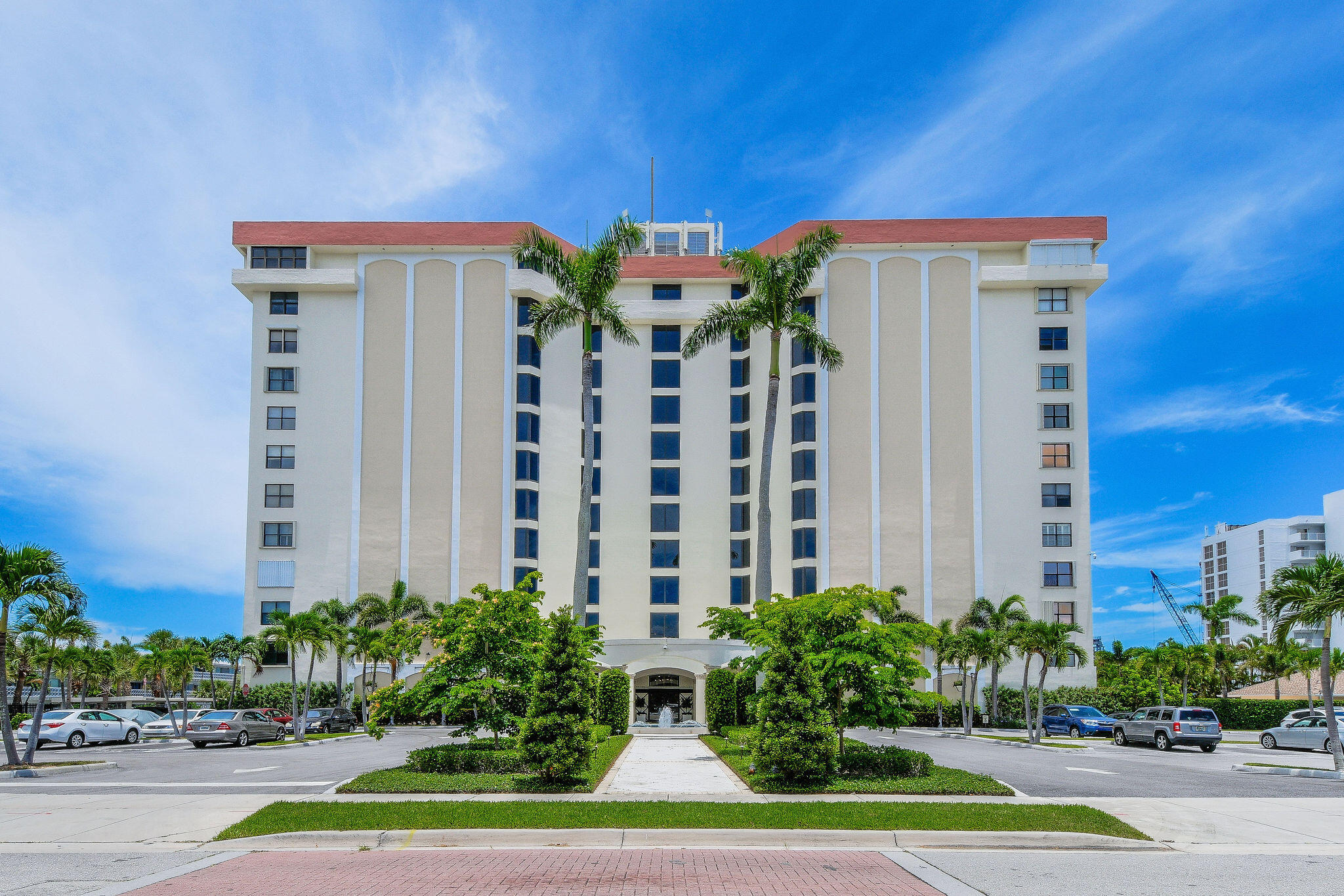 3800 Washington Road, Unit 712 West Palm Beach, FL 33405 - Photo 30 of 48 a view of a building with a yard and plants