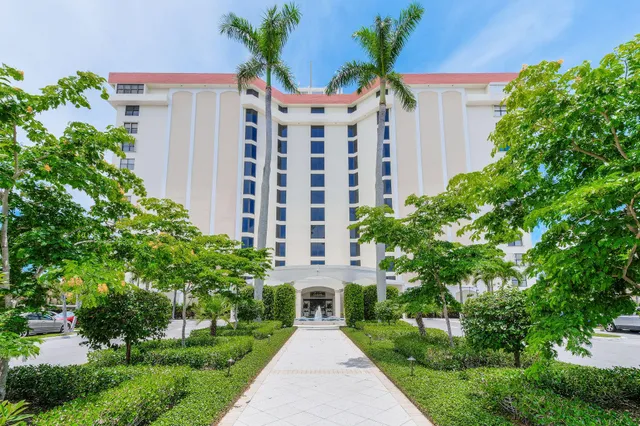 a front view of building with yard