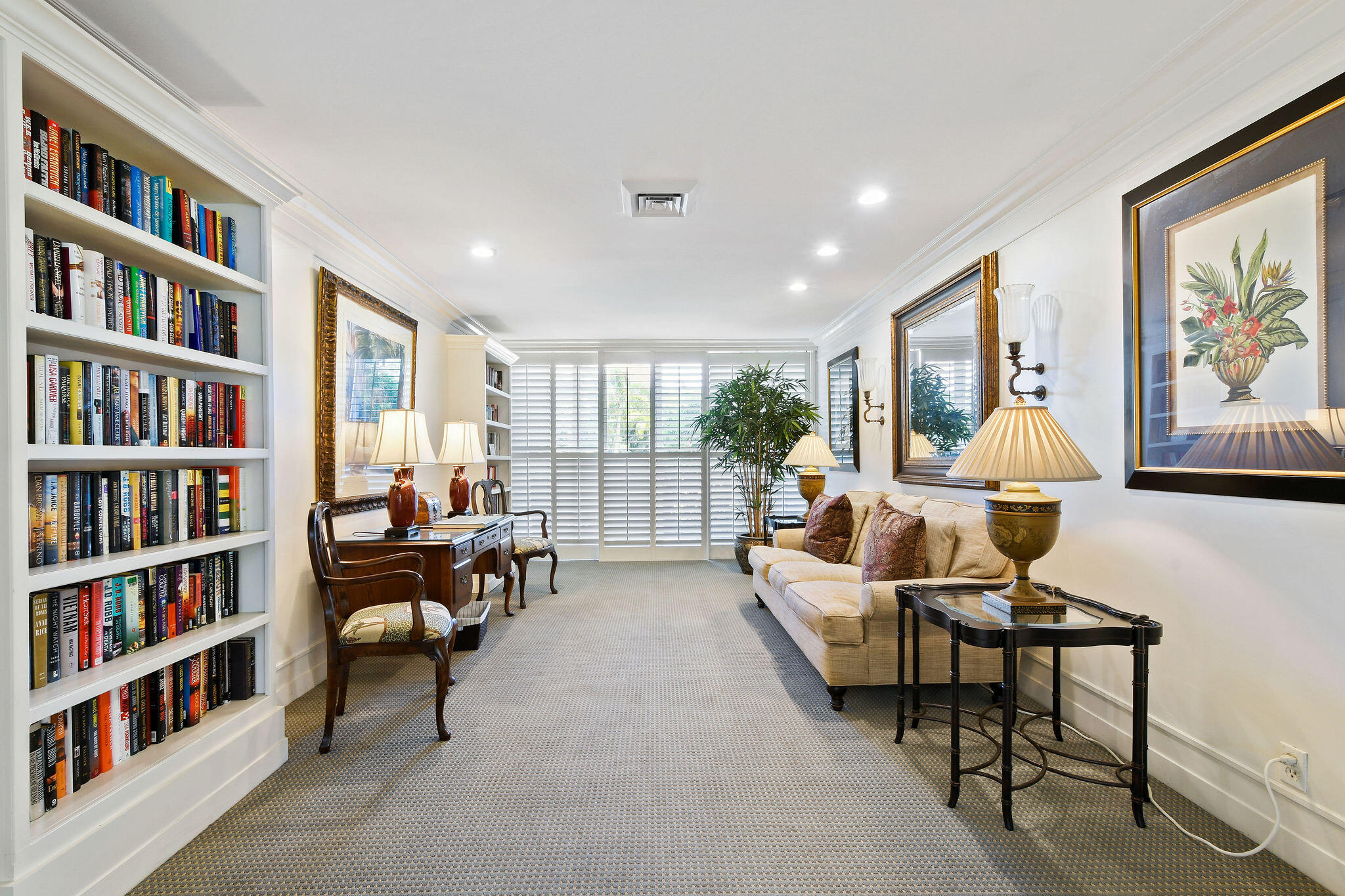 3800 Washington Road, Unit 712 West Palm Beach, FL 33405 - Photo 37 of 48 a living room with furniture and a book shelf