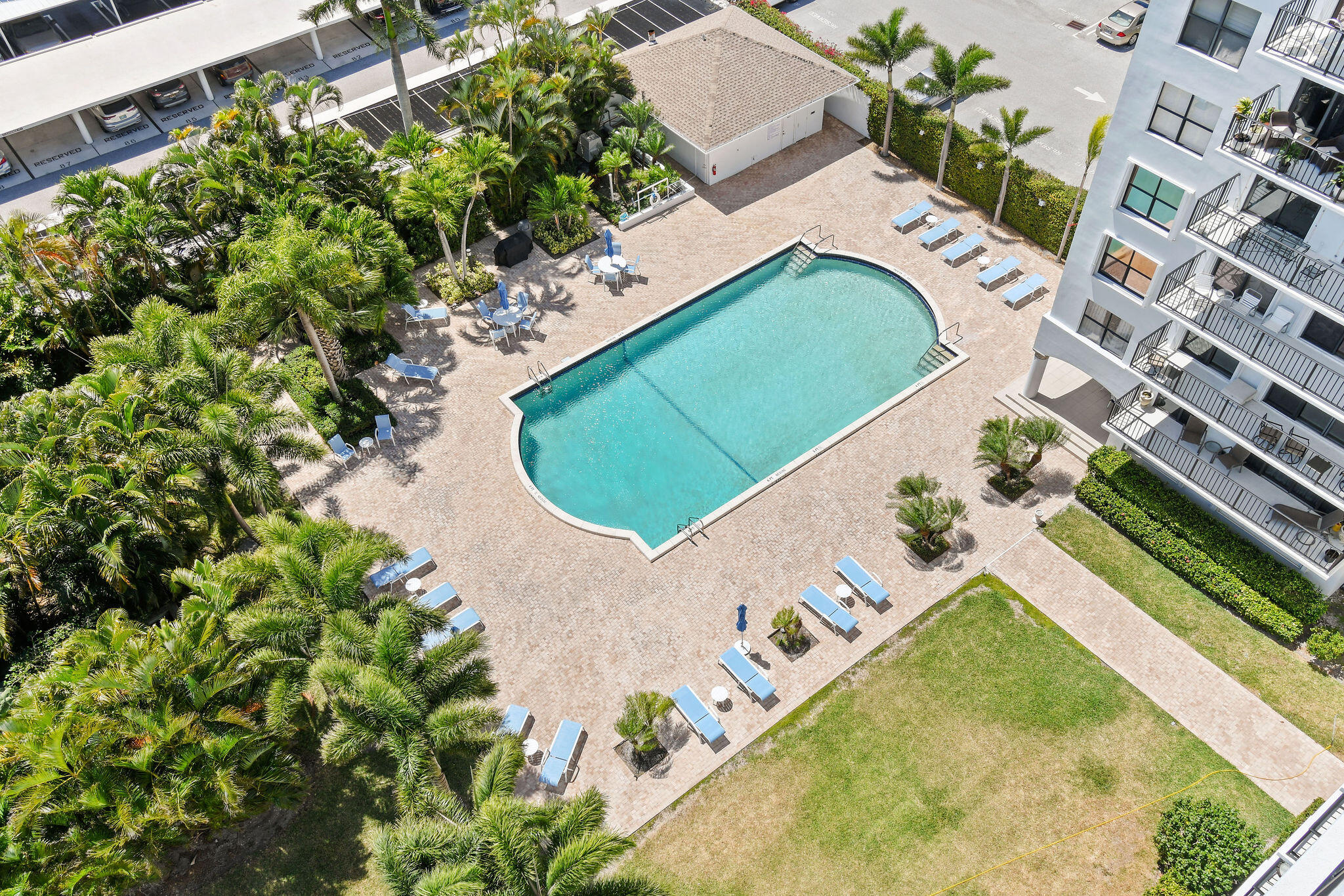 3800 Washington Road, Unit 712 West Palm Beach, FL 33405 - Photo 44 of 48 a view of a swimming pool with a yard