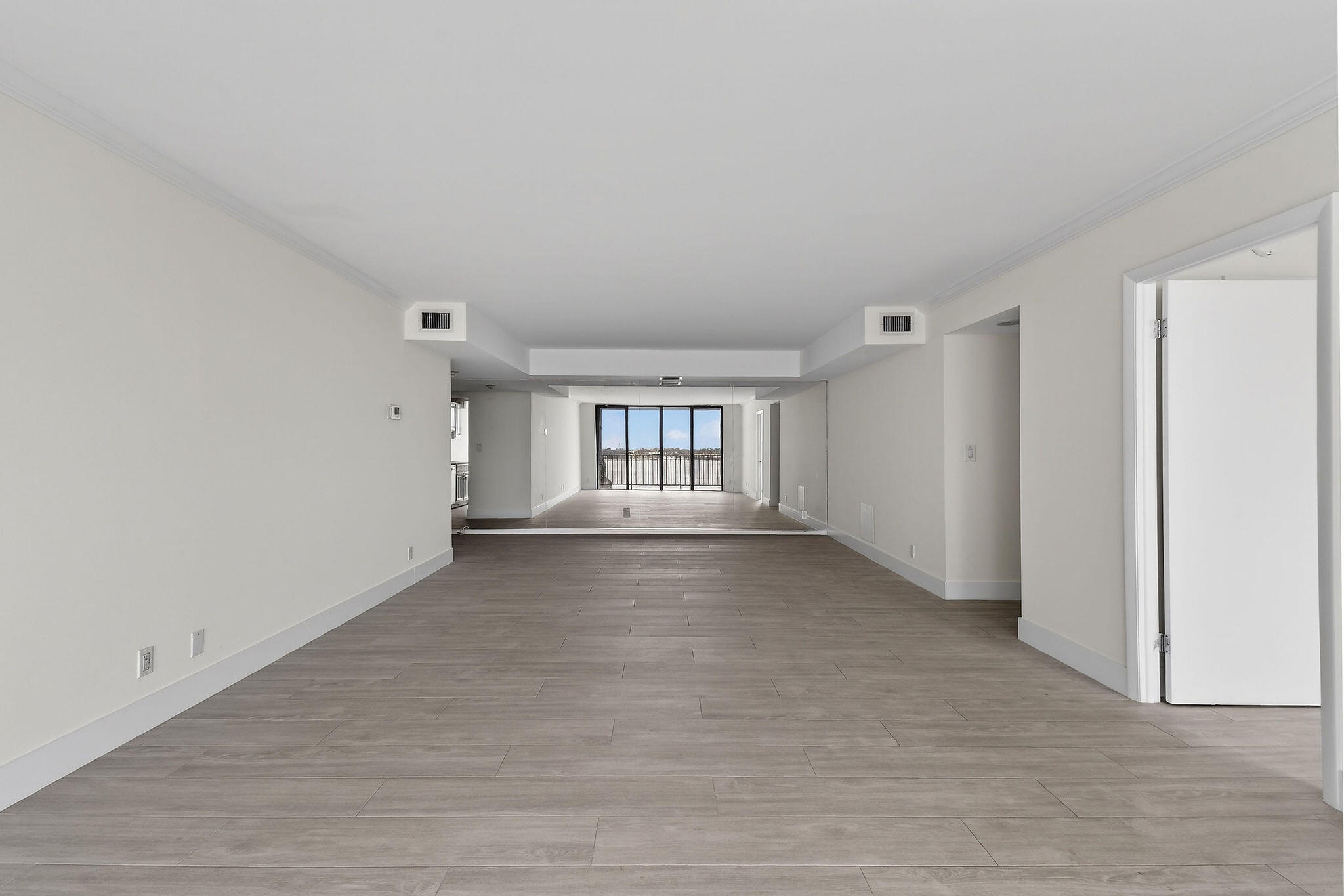 3800 Washington Road, Unit 712 West Palm Beach, FL 33405 - Photo 7 of 48 a view of an empty room with a window