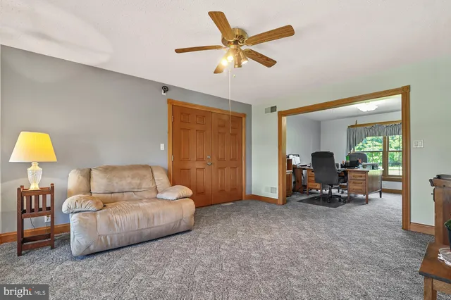 a living room with furniture and a table