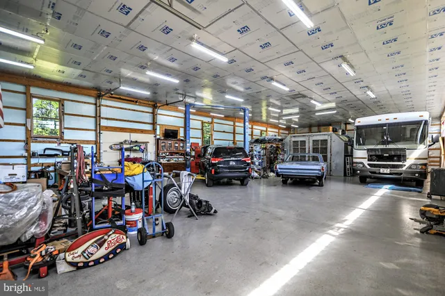 an aerial view of residential houses with outdoor space and river