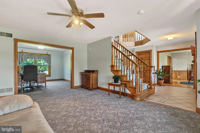 a view of livingroom with furniture and a chandelier