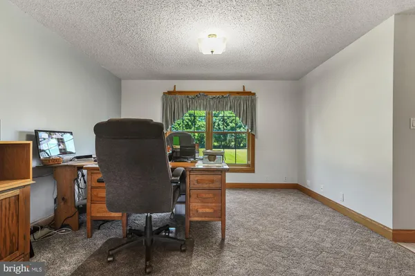 a workspace with furniture and a window