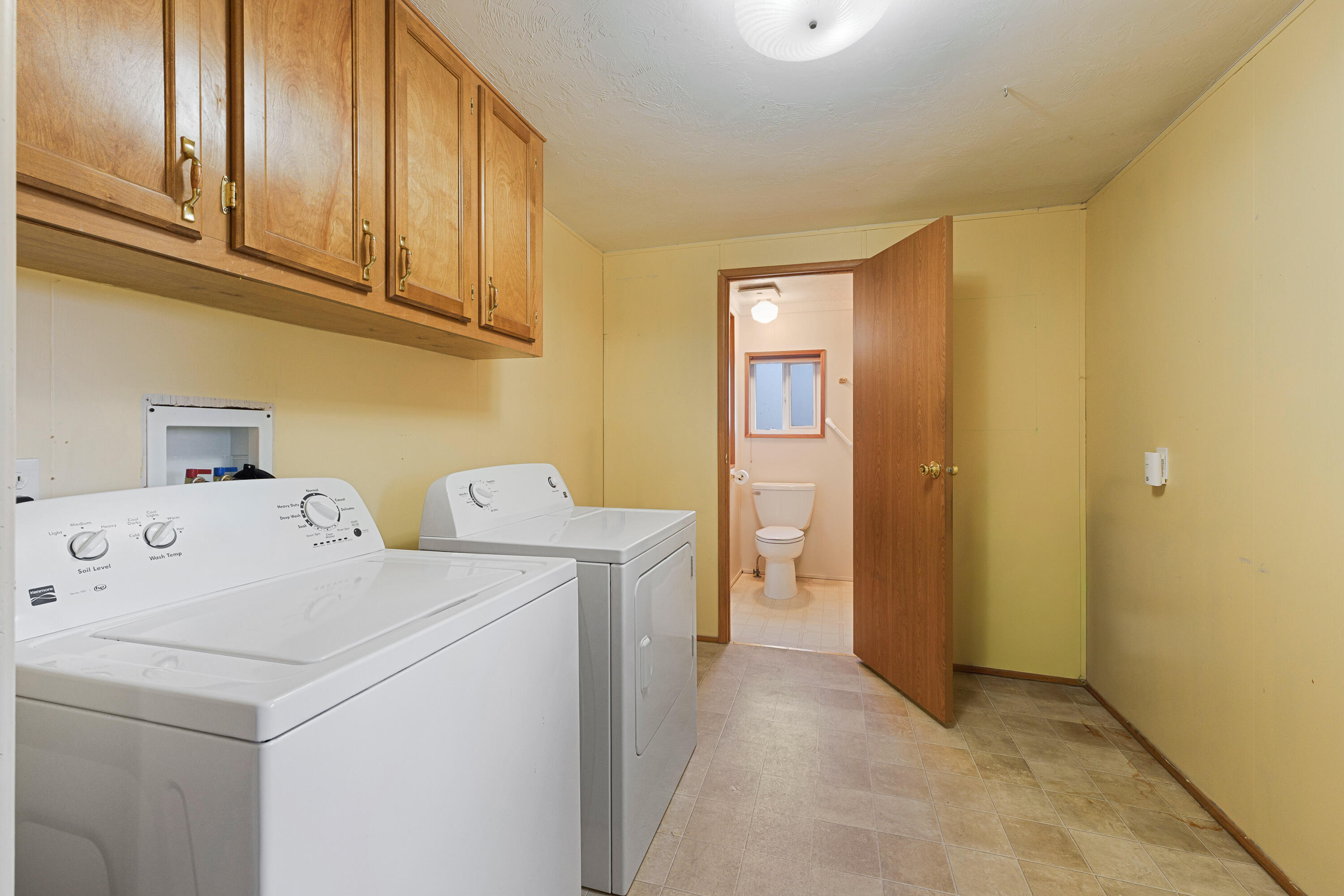 5674 Southeast Davis Loop Prineville, OR 97754 - Photo 26 of 48 a utility room with dryer and washer