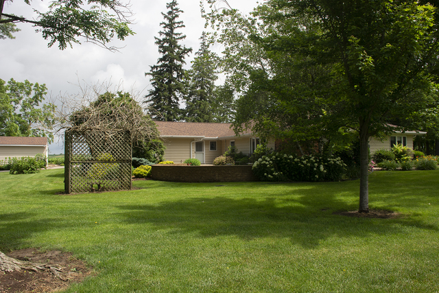 26883 Capp Road Sterling, IL 61081 - Photo 28 of 34 a view of a house with a big yard and large trees