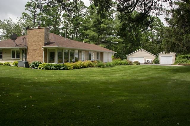 26883 Capp Road Sterling, IL 61081 - Photo 34 of 34 a front view of a house with a garden
