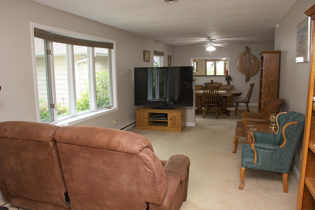 26883 Capp Road Sterling, IL 61081 - Photo 9 of 34 a living room with furniture and a flat screen tv