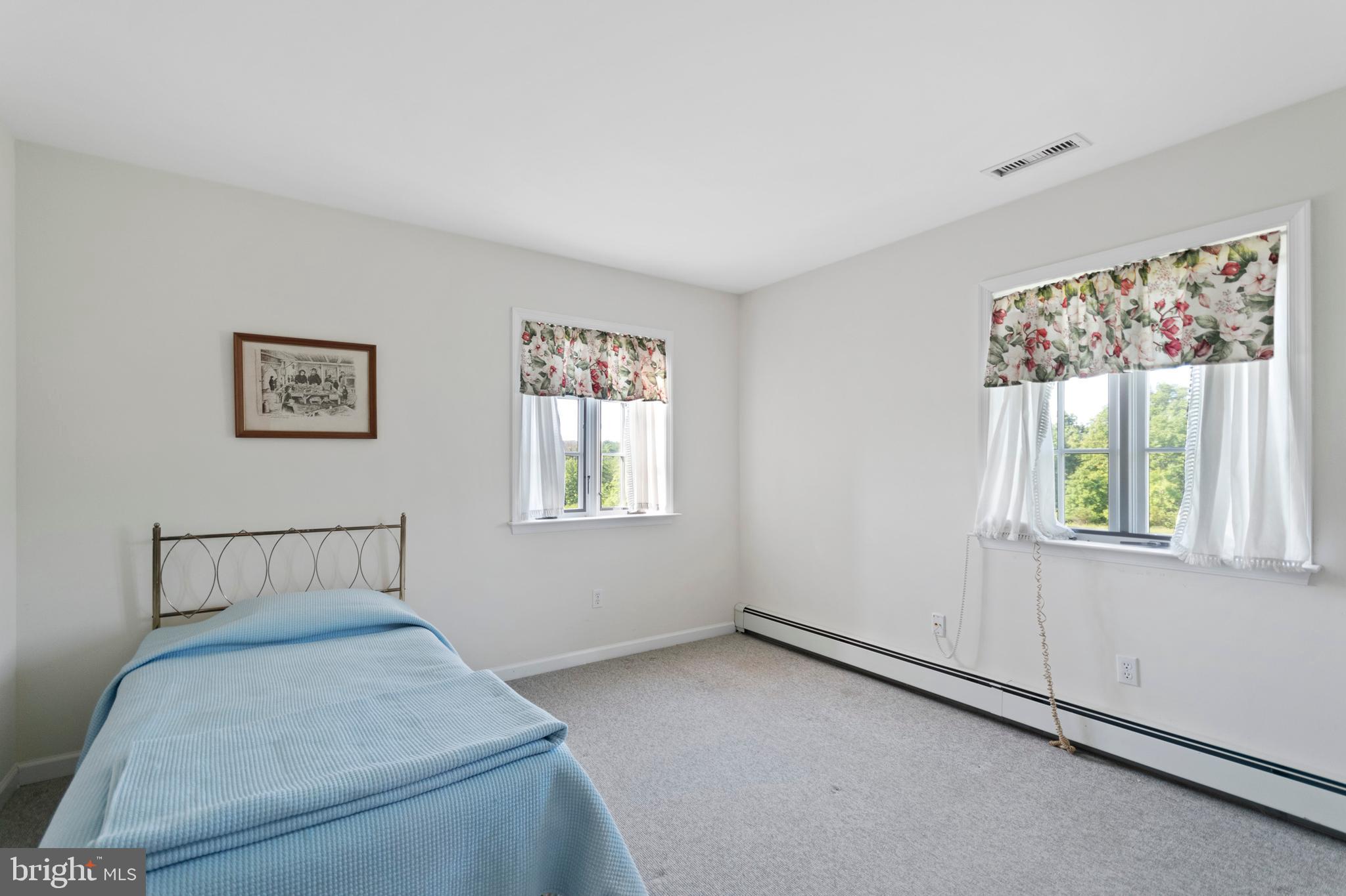 1242 Mink Road Perkasie, PA 18944 - Photo 46 of 67 a bedroom with a bed and a window