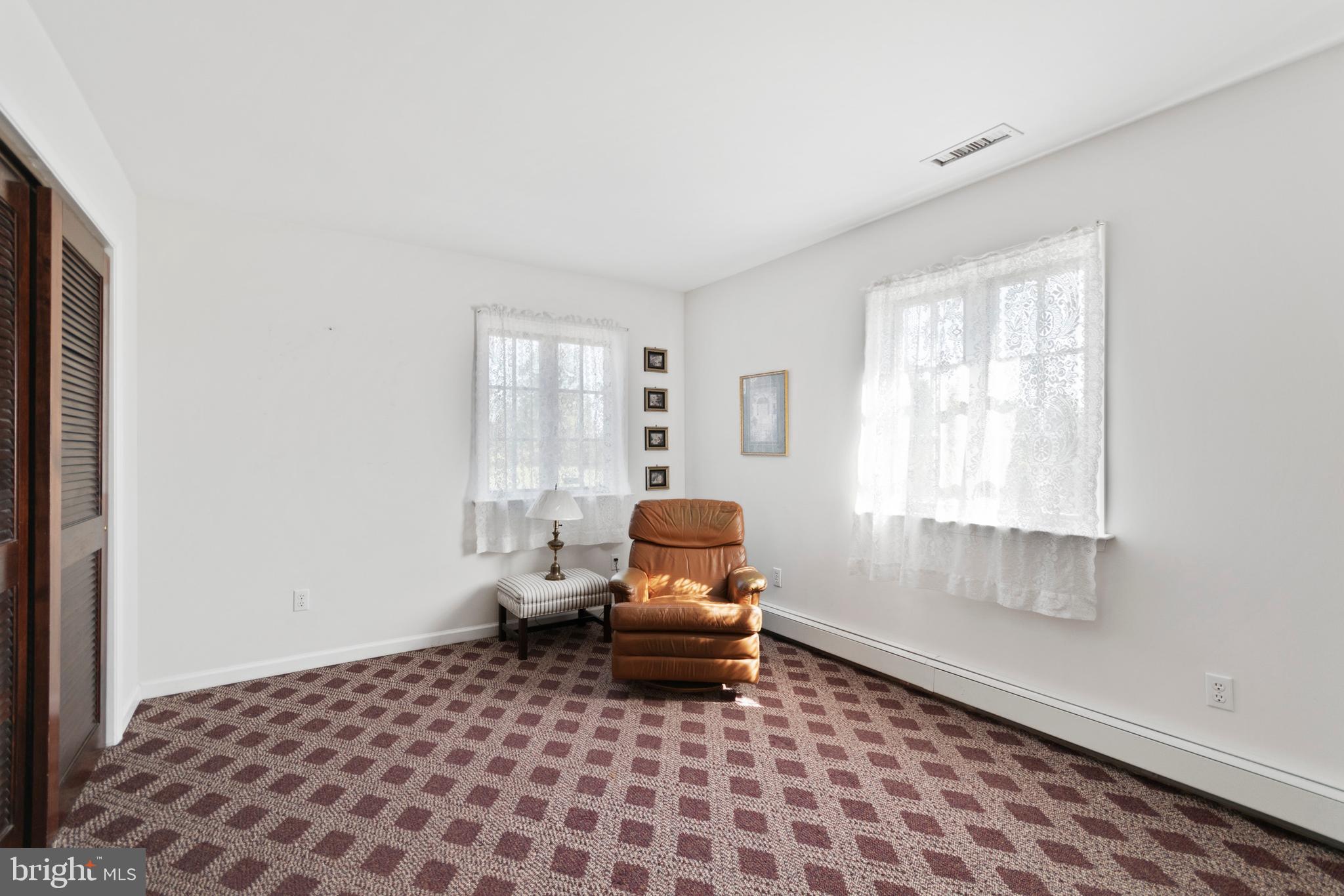 1242 Mink Road Perkasie, PA 18944 - Photo 54 of 67 a living room with a couch and a window