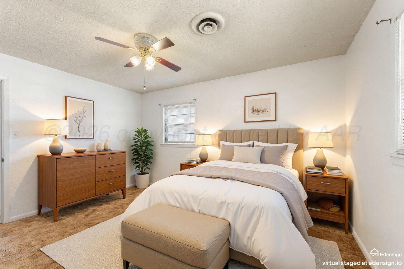 4305 South Bonham Street Amarillo, TX 79110 - Photo 36 of 48 a spacious bedroom with a bed and a chandelier