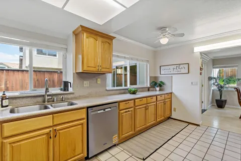 a kitchen with stainless steel appliances granite countertop a sink and cabinets