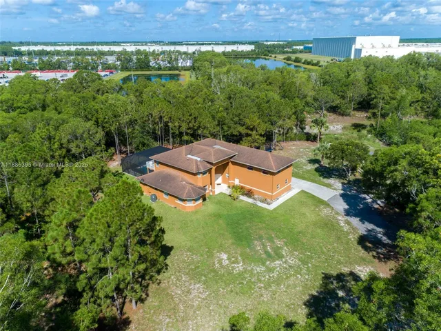 an aerial view of a house with a garden