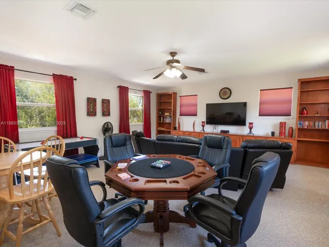 a view of staircase with railing and chandelier