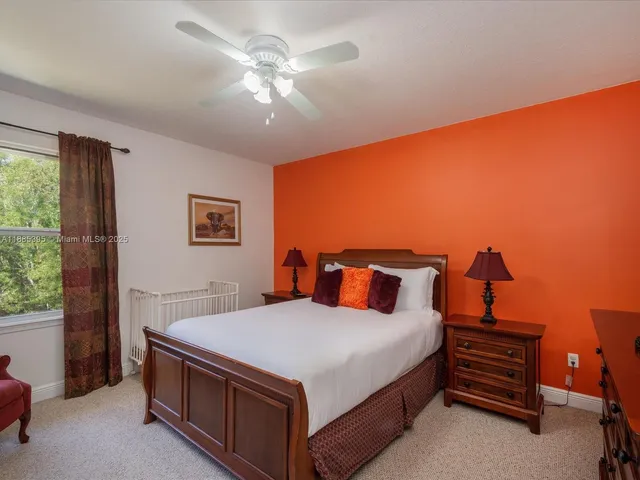 a bathroom with a sink a large mirror and a bathtub