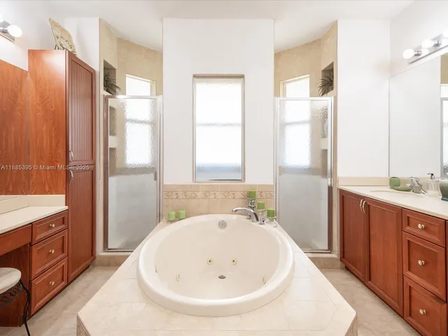 a bathroom with a sink a toilet and shower curtain