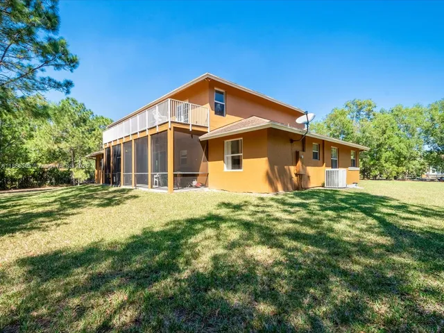 a front view of house with garden