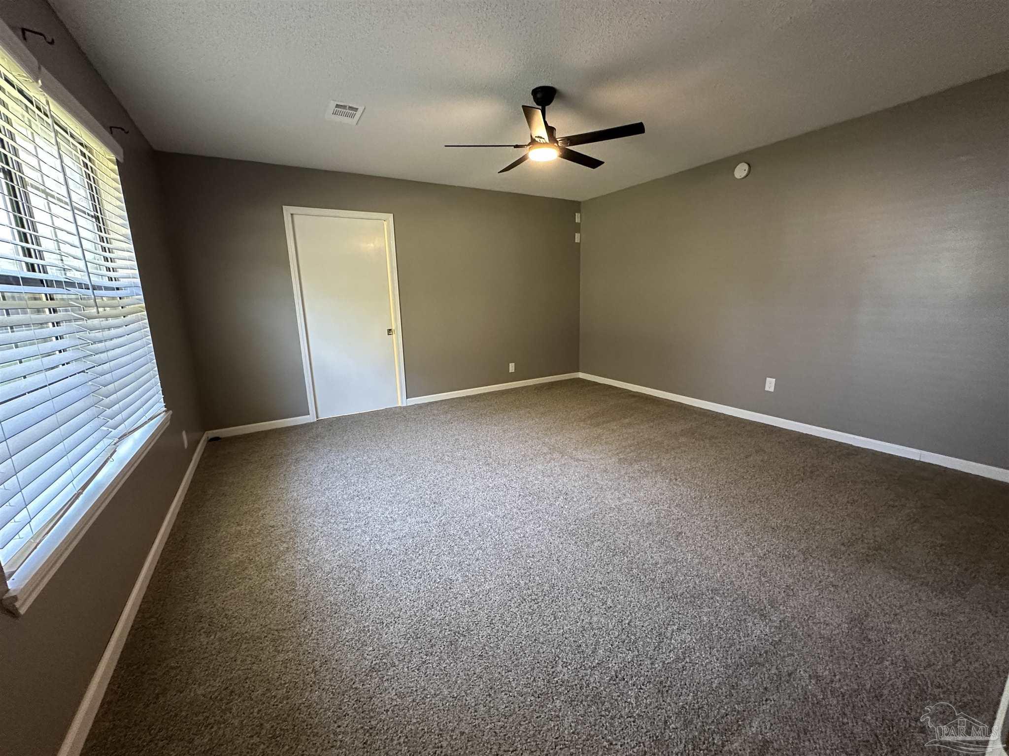 7720 Jansen Road Pensacola, FL 32526 - Photo 13 of 30 a view of an empty room with a window
