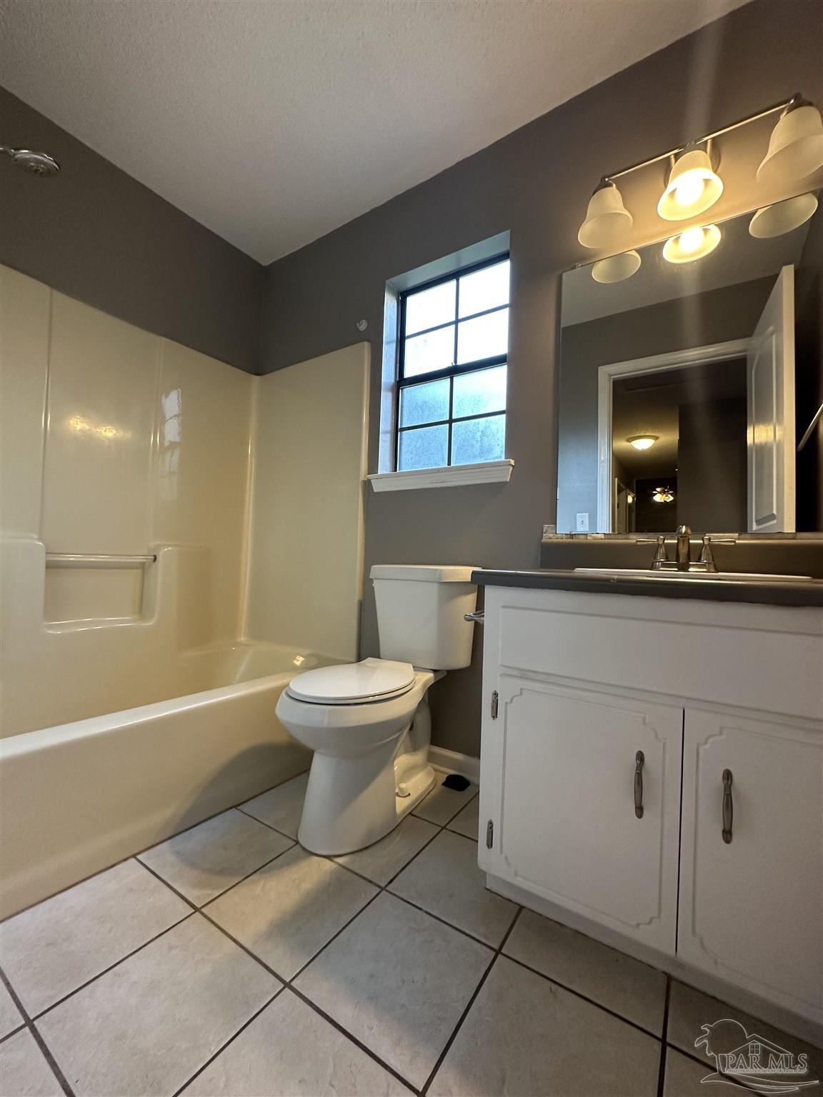 7720 Jansen Road Pensacola, FL 32526 - Photo 27 of 30 a bathroom with a sink a toilet and mirror
