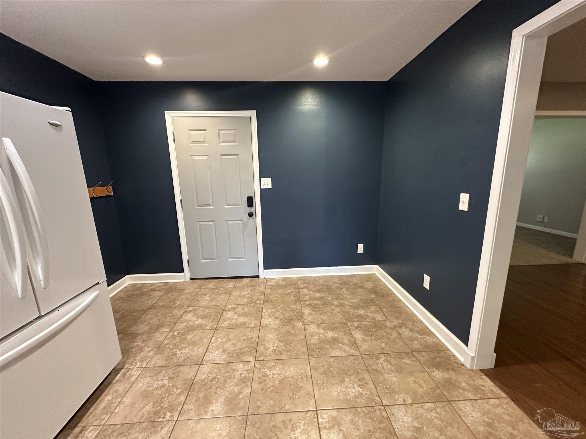 7720 Jansen Road Pensacola, FL 32526 - Photo 8 of 30 a view of hallway with furniture and a refrigerator