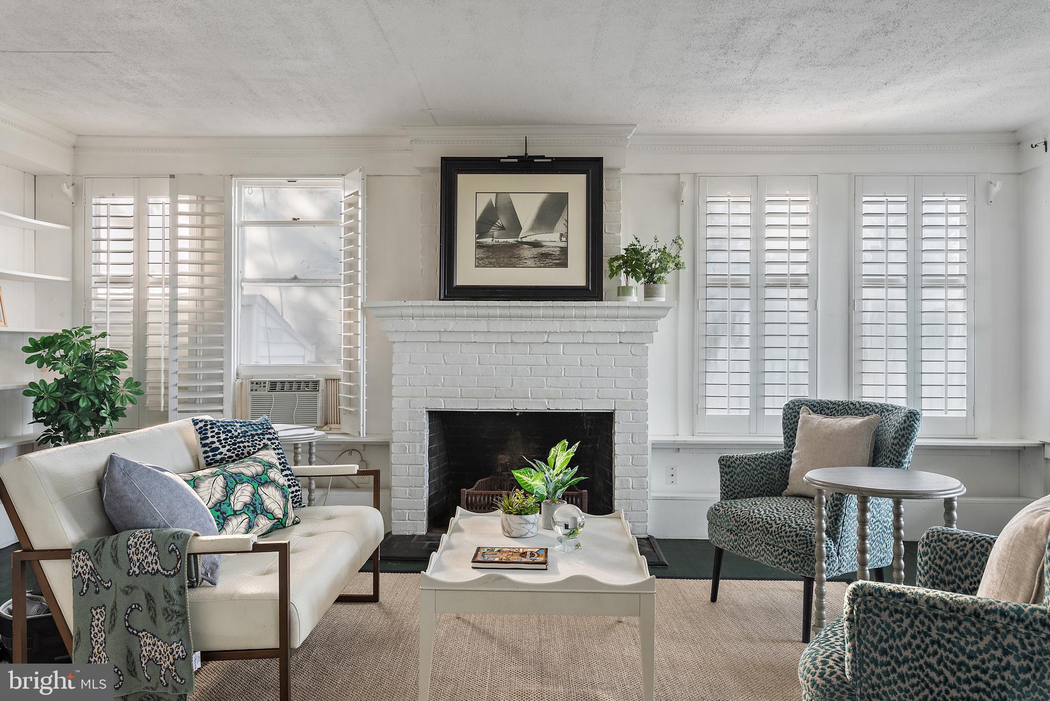 90 River Drive Annapolis, MD 21403 - Photo 11 of 44 a living room with furniture and a fireplace