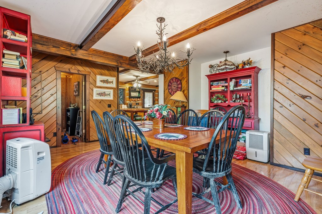 4662 Rainbow Springs Road Franklin, NC 28734 - Photo 15 of 39 a view of a dining room with furniture and wooden floor