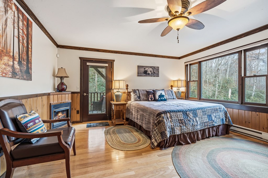 4662 Rainbow Springs Road Franklin, NC 28734 - Photo 26 of 39 a bedroom with a bed a couch and dresser