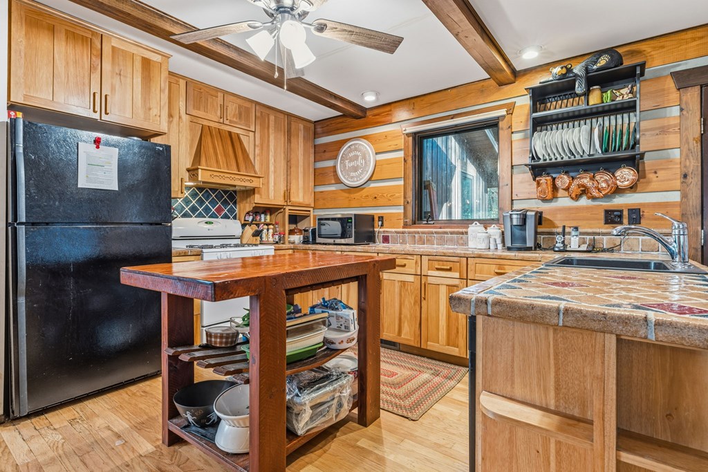 4662 Rainbow Springs Road Franklin, NC 28734 - Photo 7 of 39 a kitchen with stainless steel appliances granite countertop a stove and a sink
