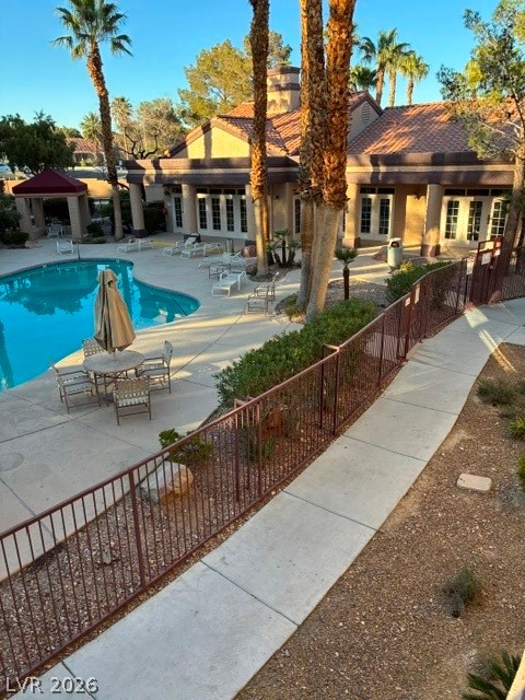 9325 West Desert Inn Road, Unit 244 Las Vegas, NV 89117 - Photo 37 of 55 An inviting pool area with ample lounging space, perfect for warm weather relaxation.