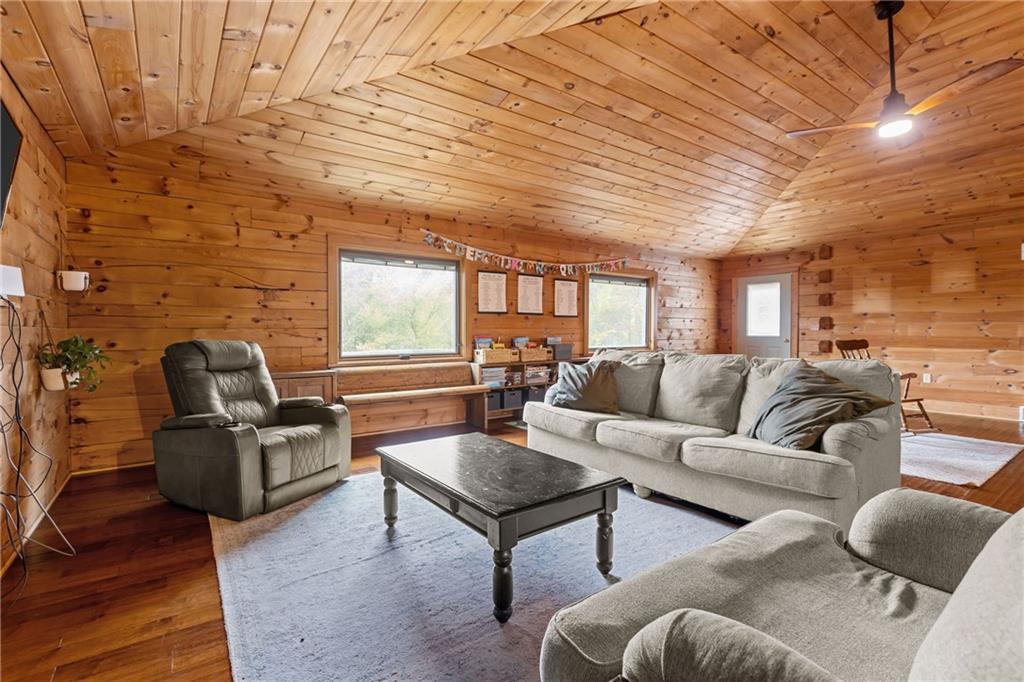 566 Pettit Road Waynesburg, PA 15370 - Photo 14 of 50 a living room with furniture wooden floor and a fireplace