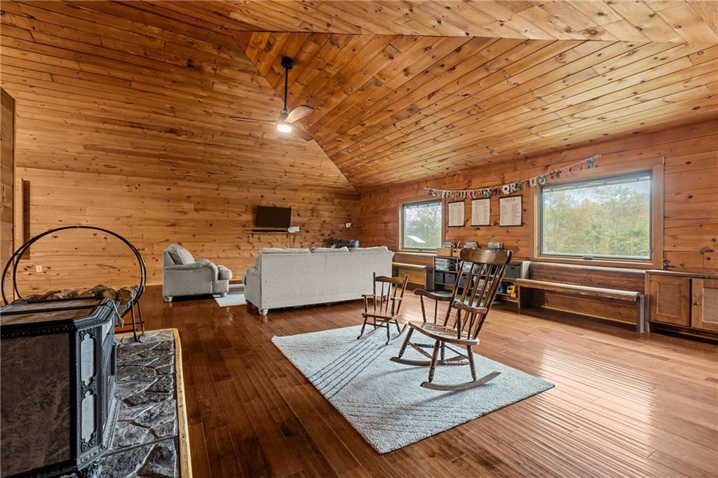 566 Pettit Road Waynesburg, PA 15370 - Photo 18 of 50 a living room with furniture a wooden floor and next to a window
