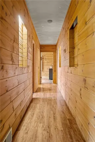 a view of a room with wooden floor and shoes