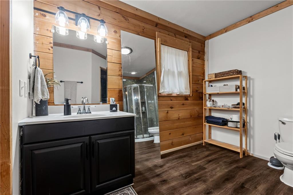 566 Pettit Road Waynesburg, PA 15370 - Photo 33 of 50 a kitchen with a wooden floor and cabinets