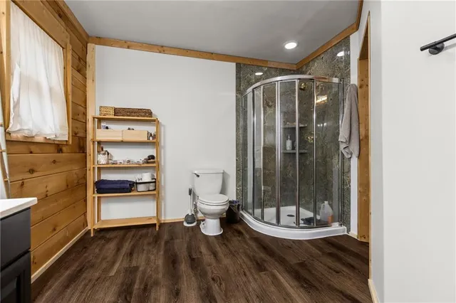 a view of walk in closet with clothes