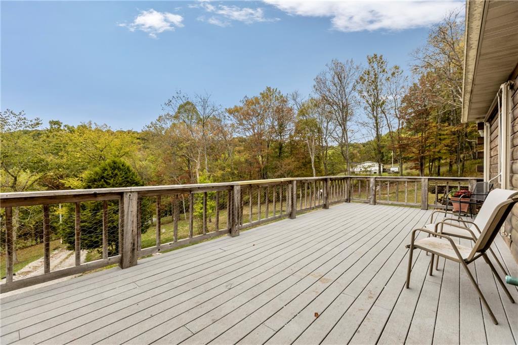 566 Pettit Road Waynesburg, PA 15370 - Photo 7 of 50 a view of a balcony with wooden floor and fence
