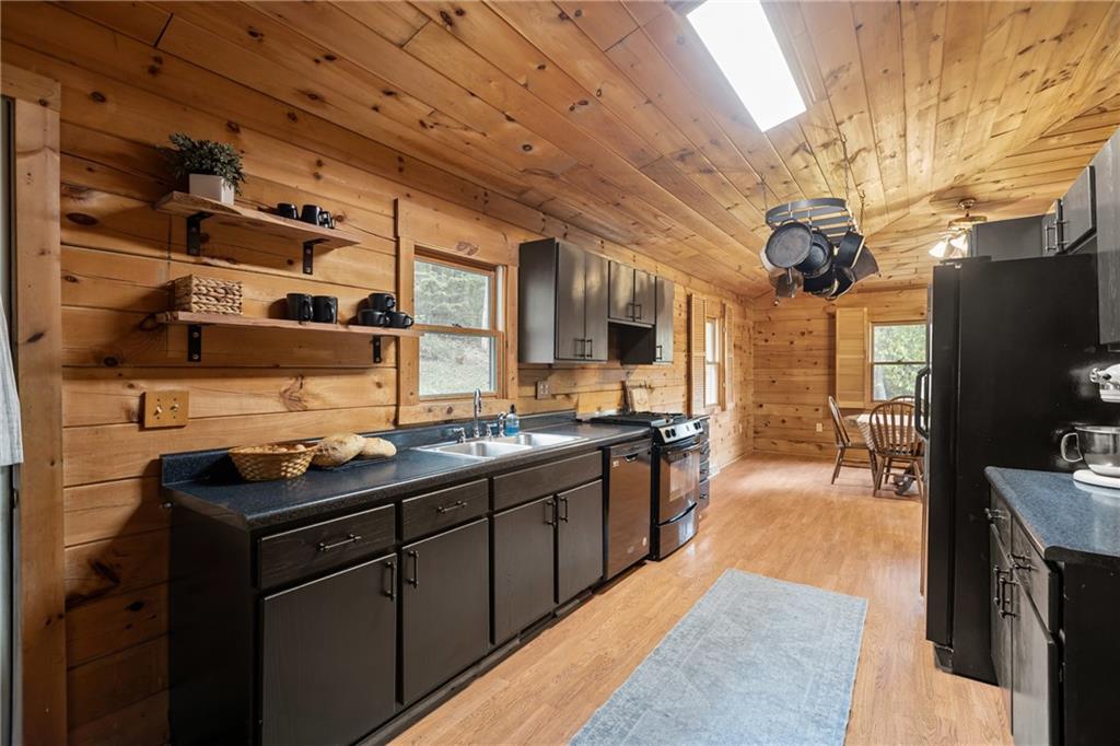 566 Pettit Road Waynesburg, PA 15370 - Photo 8 of 50 a kitchen with stainless steel appliances a stove a sink dishwasher and cabinets