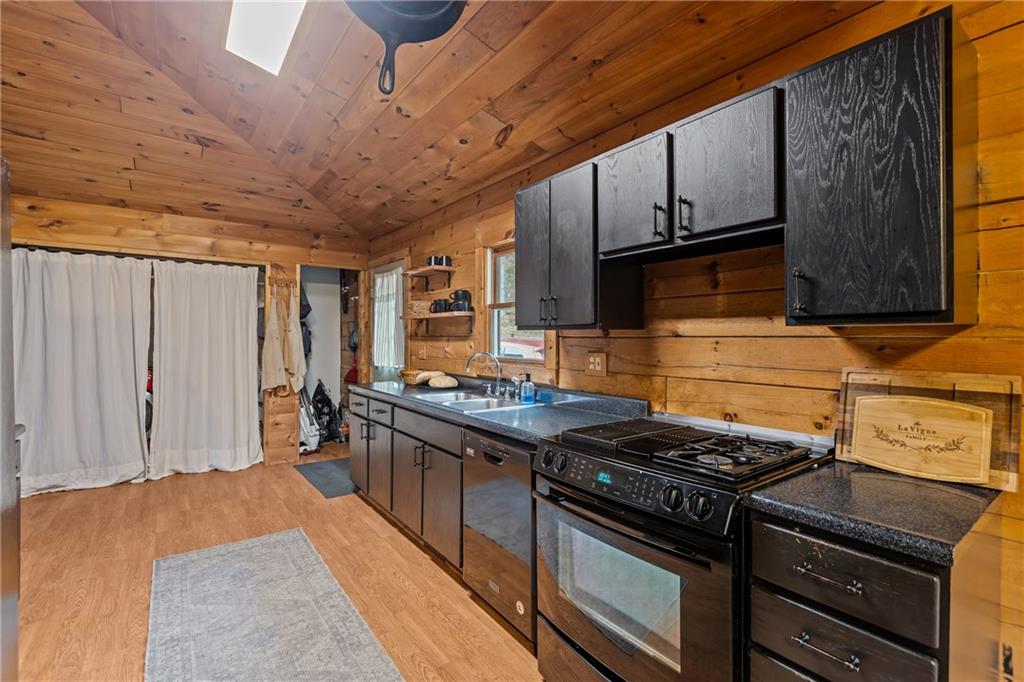 566 Pettit Road Waynesburg, PA 15370 - Photo 10 of 50 a kitchen with stainless steel appliances granite countertop a stove and a refrigerator