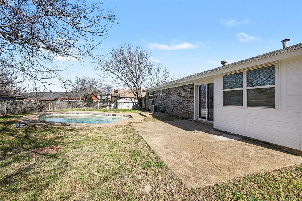 125 Roundtree Street Crowley, TX 76036 - Photo 18 of 25 a view of pool with tree in front of it