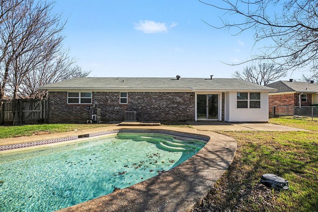 125 Roundtree Street Crowley, TX 76036 - Photo 20 of 25 a view of a house with swimming pool and a yard