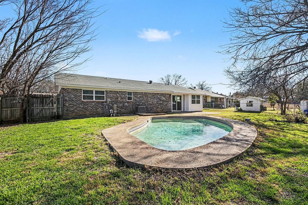 125 Roundtree Street Crowley, TX 76036 - Photo 22 of 25 front view of a house with a yard