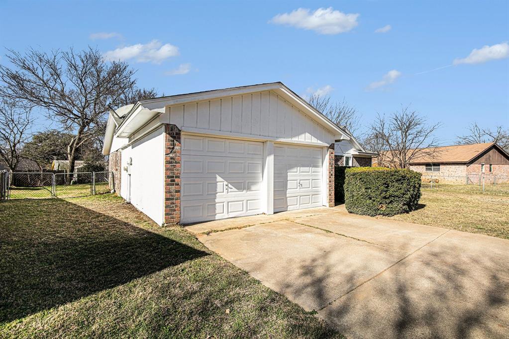 125 Roundtree Street Crowley, TX 76036 - Photo 23 of 25 a view of a house with a yard