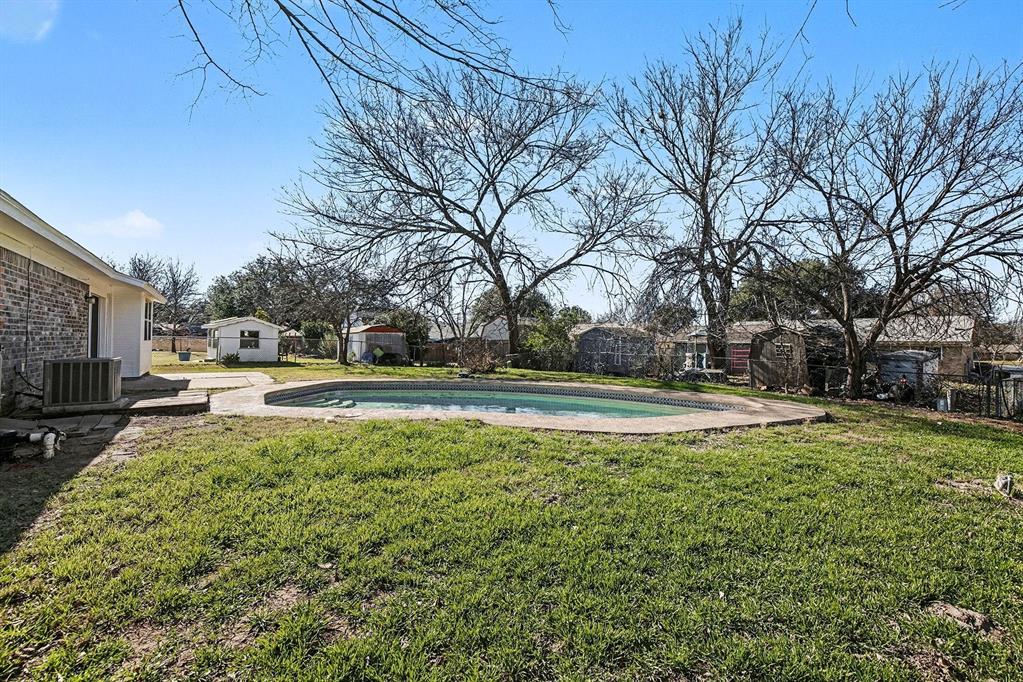 125 Roundtree Street Crowley, TX 76036 - Photo 24 of 25 a view of yard with swimming pool and green space