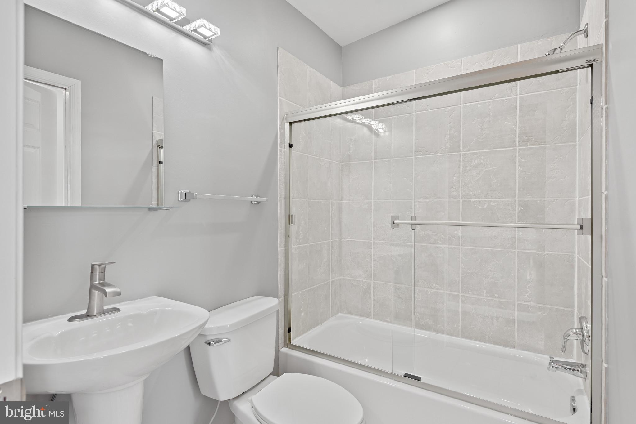 1410 Ramsay Street Baltimore, MD 21223 - Photo 10 of 23 Front Bedroom with Clean and Modern Full Bathroom
