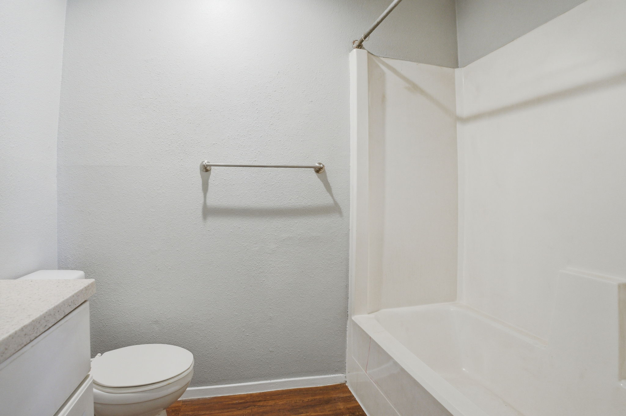 5204 Nuckols Crossing Road, Unit B Austin, TX 78744 - Photo 10 of 16 a bathroom with a toilet and a bathtub
