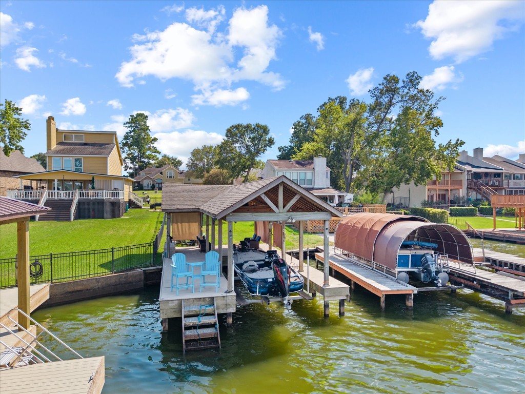 Directly across from the home, is this lake lot included with home sale feat. newer boathouse, boat lift.